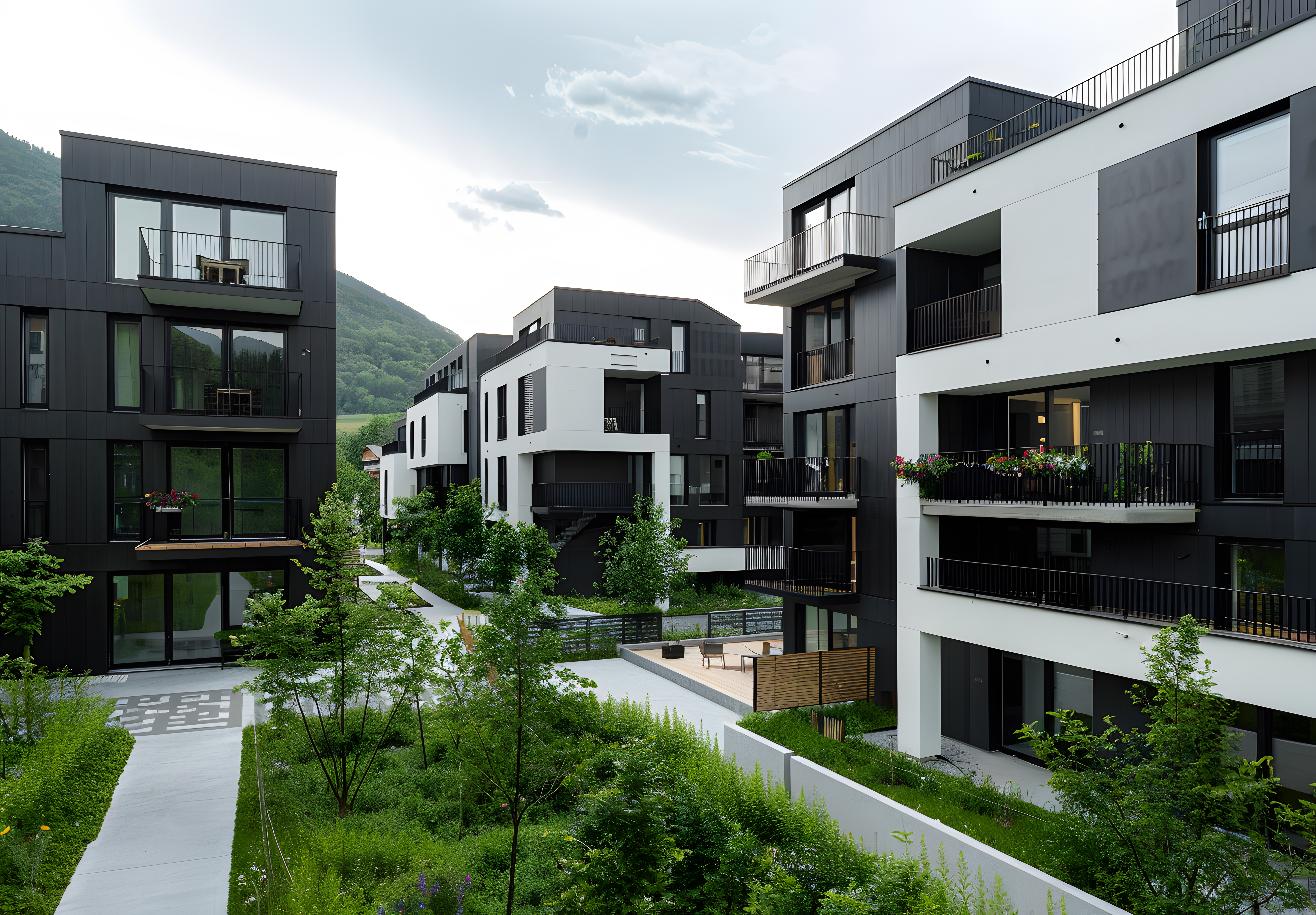 Contemporary residential buildings with balconies and gardens